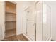 Modern bathroom showcasing a walk-in shower and open doorway leading to a spacious walk-in closet at 352 E Las Perlas Ln, San Tan Valley, AZ 85140