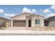 Charming single-story home featuring a two-car garage, low maintenance landscaping, and desert accents at 352 E Las Perlas Ln, San Tan Valley, AZ 85140