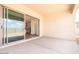 Covered patio with concrete flooring, sliding glass doors and a peek of the indoor kitchen at 352 E Las Perlas Ln, San Tan Valley, AZ 85140