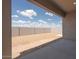 View of backyard with block fence, patio, and desert landscape at 366 E Las Perlas Ln, San Tan Valley, AZ 85140
