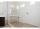Modern bathroom with glass shower and white tile with a built in seat at 366 E Las Perlas Ln, San Tan Valley, AZ 85140