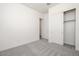 A bright, clean bedroom with plush carpeting and a closet, ready for personal touches at 366 E Las Perlas Ln, San Tan Valley, AZ 85140