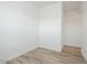 Neutral bedroom featuring wood-look floors and freshly painted white walls at 366 E Las Perlas Ln, San Tan Valley, AZ 85140