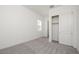 This bedroom features a closet, carpet flooring, and neutral paint at 366 E Las Perlas Ln, San Tan Valley, AZ 85140