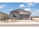 Charming single-story home with a two-car garage, gray trim, and low-maintenance landscaping at 366 E Las Perlas Ln, San Tan Valley, AZ 85140