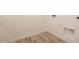 Functional laundry area with hookups, wood-look floors and white trim at 366 E Las Perlas Ln, San Tan Valley, AZ 85140