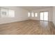 Spacious living area filled with natural light and featuring wood-look floors at 366 E Las Perlas Ln, San Tan Valley, AZ 85140