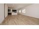 Open-concept living space featuring wood-look floors and ample natural light at 366 E Las Perlas Ln, San Tan Valley, AZ 85140