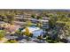 Aerial shot of a house and neighborhood with tree-lined streets and lush surroundings at 37 Spur Cir, Scottsdale, AZ 85251