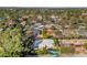 Aerial view showcasing homes surrounded by mature trees and landscaping with a pool at 37 Spur Cir, Scottsdale, AZ 85251