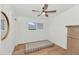 Bedroom features a minimalist design with wood floors and a large mirror on the wall at 37 Spur Cir, Scottsdale, AZ 85251
