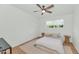Bedroom featuring a ceiling fan, natural light from the window, and simple furniture at 37 Spur Cir, Scottsdale, AZ 85251