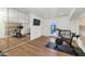 Home gym with mirrored wall, stationary bikes, and an exterior door for easy access at 37 Spur Cir, Scottsdale, AZ 85251