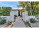 Charming gated front entrance with stone accents and a welcoming pathway at 37 Spur Cir, Scottsdale, AZ 85251