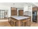 Stylish kitchen featuring a large island with seating and modern appliances at 37 Spur Cir, Scottsdale, AZ 85251