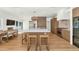 Bright and spacious kitchen with a large island and an adjacent dining area at 37 Spur Cir, Scottsdale, AZ 85251