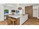 Open kitchen layout with a large island, integrated appliances, and a dining nook at 37 Spur Cir, Scottsdale, AZ 85251