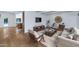 Bright living room with hardwood floors, sleek furniture, and a large rug at 37 Spur Cir, Scottsdale, AZ 85251