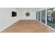 Bright living room boasts wood floors and large windows allowing for ample natural light at 37 Spur Cir, Scottsdale, AZ 85251