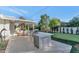 Outdoor kitchen and entertaining area with a built-in grill and cooler, ideal for backyard gatherings at 37 Spur Cir, Scottsdale, AZ 85251