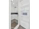 Sleek walk-in shower with a glass door, gray tiled floor, and convenient built-in shelving at 37 Spur Cir, Scottsdale, AZ 85251