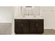 Modern bathroom with a dual sink vanity and a walk-in shower at 37098 W Prado St, Maricopa, AZ 85138