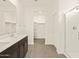 Spacious bathroom with walk-in closet and a glass-enclosed shower at 37098 W Prado St, Maricopa, AZ 85138