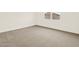 Bright bedroom with a window view and carpet at 37098 W Prado St, Maricopa, AZ 85138