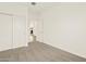 Carpeted bedroom with sliding door closet and bright natural light at 37098 W Prado St, Maricopa, AZ 85138