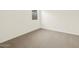 Cozy bedroom featuring carpet flooring, bright natural light, and neutral tones at 37098 W Prado St, Maricopa, AZ 85138
