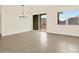 Dining area with sliding glass door access to backyard at 37098 W Prado St, Maricopa, AZ 85138