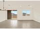 Dining area with sliding glass door and window at 37098 W Prado St, Maricopa, AZ 85138