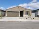 Charming single-story home with a two-car garage, desert landscaping, and a welcoming entrance at 37098 W Prado St, Maricopa, AZ 85138