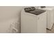 Modern white washer and dryer in the laundry room at 37098 W Prado St, Maricopa, AZ 85138