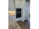 Modern kitchen featuring stainless steel appliances and white cabinetry at 3746 E Rochelle Cir, Mesa, AZ 85215