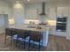 Bright kitchen features granite counters, island seating and stainless appliances at 3746 E Rochelle Cir, Mesa, AZ 85215