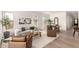 Stylish living room with neutral colors, modern decor, tile floors, and abundant natural light at 3746 E Rochelle Cir, Mesa, AZ 85215