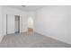 Bedroom featuring neutral carpet, a large closet, and a door to another room at 3937 S 233Rd Ln, Buckeye, AZ 85326
