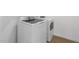 Modern laundry room showcases a new washer and dryer set against a clean, minimalist backdrop with modern appliances at 3937 S 233Rd Ln, Buckeye, AZ 85326