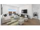 Comfortable living room with plush seating, neutral decor, and ample natural light at 3937 S 233Rd Ln, Buckeye, AZ 85326