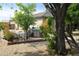 Charming backyard offers a built-in BBQ and outdoor dining area, perfect for entertaining at 3957 N 148Th Dr, Goodyear, AZ 85395