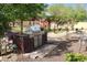 Outdoor kitchen features a built-in stainless steel BBQ, perfect for outdoor entertaining at 3957 N 148Th Dr, Goodyear, AZ 85395
