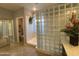 Modern bathroom with glass block shower, offering a bright and open space at 3957 N 148Th Dr, Goodyear, AZ 85395