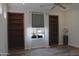 Bright bedroom with built-in bookcases, hardwood floors and natural light at 3957 N 148Th Dr, Goodyear, AZ 85395
