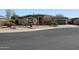 Charming home featuring desert landscaping, stone accents, and a covered entry at 3957 N 148Th Dr, Goodyear, AZ 85395