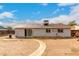 Backyard featuring minimal landscaping and a rock walkway at 4031 N 81St Ave, Phoenix, AZ 85033
