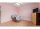 Bedroom with a ceiling fan, tile floor, and window that offers plenty of natural light at 4031 N 81St Ave, Phoenix, AZ 85033