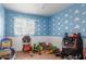 room with tile floors, cloud-themed painted blue walls, and bright natural light at 4031 N 81St Ave, Phoenix, AZ 85033