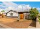 Quaint home with a palm tree, front yard, and a convenient covered carport at 4031 N 81St Ave, Phoenix, AZ 85033