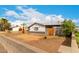 Quaint home with a palm tree, front yard, and a convenient covered carport at 4031 N 81St Ave, Phoenix, AZ 85033
